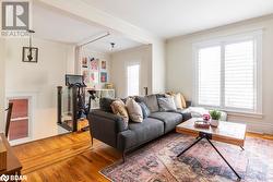 Family room featuring hardwood floors and crown molding - 