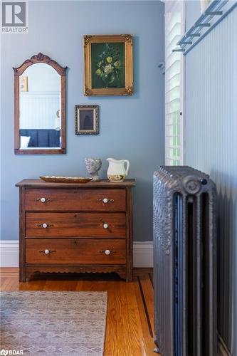 Details with radiator and hardwood flooring - 109 Fairleigh Avenue S, Hamilton, ON - Indoor