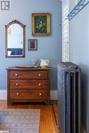 Details with radiator and hardwood flooring - 