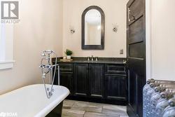 Bathroom featuring vanity and a claw tub to relax in - 