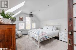 Bedroom with lofted ceiling with skylight - 