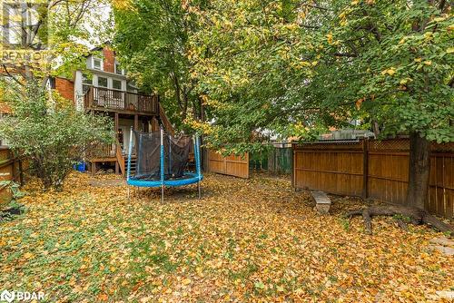 View of yard with a trampoline and a deck - 109 Fairleigh Avenue S, Hamilton, ON - Outdoor