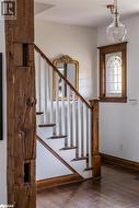 Stairs featuring hardwood flooring - 