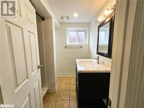 Bathroom with vanity, tile patterned floors, and walk in shower - 1306 Leighland Road Unit# Ll, Burlington, ON - Indoor Photo Showing Bathroom