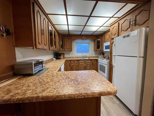 218 Rd & Hwy #10 Highway, Swan River, MB - Indoor Photo Showing Kitchen With Double Sink