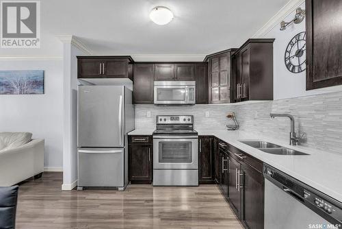 1207 130 Marlatte Crescent, Saskatoon, SK - Indoor Photo Showing Kitchen With Stainless Steel Kitchen With Double Sink With Upgraded Kitchen