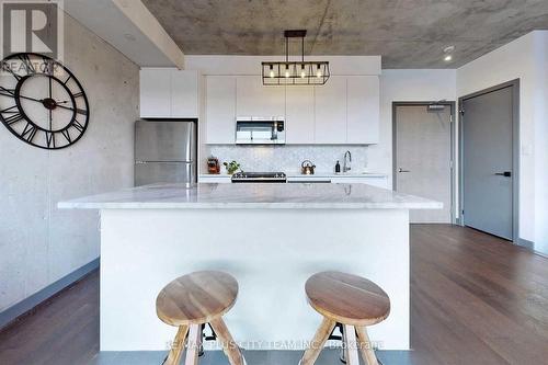 717 - 246 Logan Avenue, Toronto, ON - Indoor Photo Showing Kitchen With Upgraded Kitchen