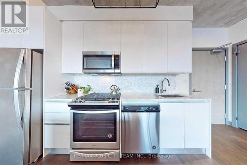 717 - 246 Logan Avenue, Toronto, ON - Indoor Photo Showing Kitchen With Upgraded Kitchen