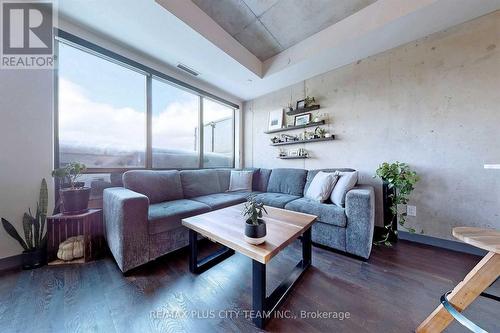 717 - 246 Logan Avenue, Toronto, ON - Indoor Photo Showing Living Room