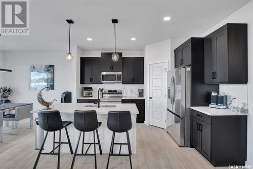 413 Germain Manor, Saskatoon, SK - Indoor Photo Showing Kitchen With Stainless Steel Kitchen With Upgraded Kitchen