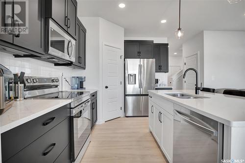 413 Germain Manor, Saskatoon, SK - Indoor Photo Showing Kitchen With Stainless Steel Kitchen With Double Sink With Upgraded Kitchen