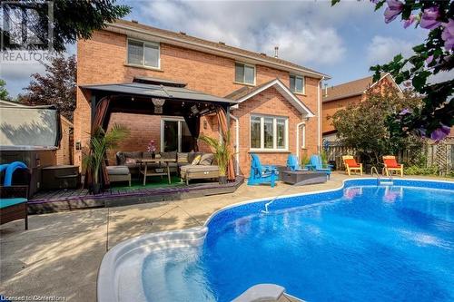 View of swimming pool with a gazebo, a patio area, a jacuzzi, and an outdoor hangout area - 134 Bayne Crescent, Cambridge, ON 