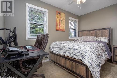 Bedroom with a textured ceiling, ceiling fan, and light carpet - 134 Bayne Crescent, Cambridge, ON 