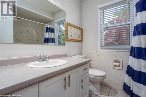 Bathroom with tile patterned flooring, vanity, and toilet - 134 Bayne Crescent, Cambridge, ON 