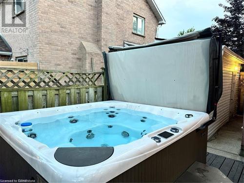 View of patio featuring a hot tub - 134 Bayne Crescent, Cambridge, ON 