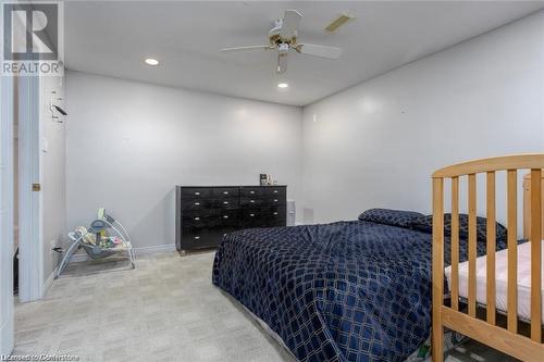 Carpeted bedroom with ceiling fan - 134 Bayne Crescent, Cambridge, ON 