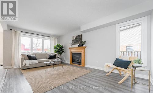 565 Avignon Place, Waterloo, ON - Indoor Photo Showing Living Room With Fireplace