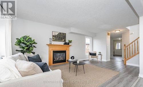 565 Avignon Place, Waterloo, ON - Indoor Photo Showing Living Room With Fireplace