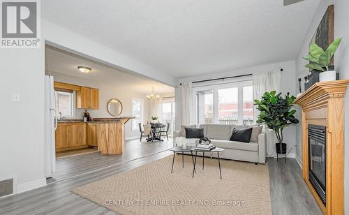 565 Avignon Place, Waterloo, ON - Indoor Photo Showing Living Room With Fireplace