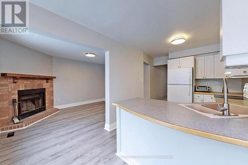 10 Weatherup Crescent, Barrie, ON - Indoor Photo Showing Kitchen With Fireplace