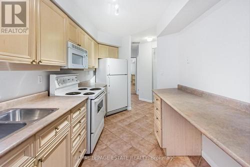 202 - 2365 Queen Street E, Toronto, ON - Indoor Photo Showing Kitchen With Double Sink