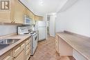 202 - 2365 Queen Street E, Toronto, ON  - Indoor Photo Showing Kitchen With Double Sink 