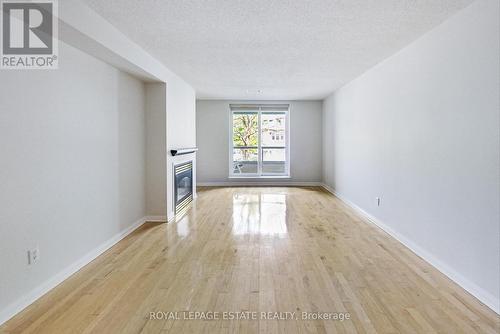 202 - 2365 Queen Street E, Toronto, ON - Indoor Photo Showing Other Room With Fireplace