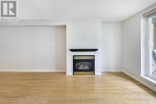 202 - 2365 Queen Street E, Toronto, ON - Indoor Photo Showing Living Room With Fireplace