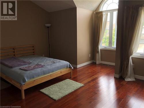 Bedroom with multiple windows, dark hardwood / wood-style flooring, and vaulted ceiling - 356 Havendale Crescent, Waterloo, ON - Indoor Photo Showing Bedroom