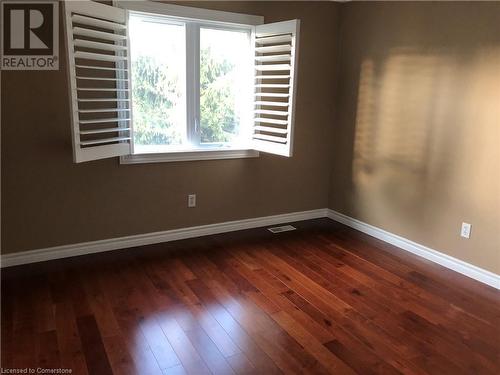 Empty room with dark hardwood / wood-style floors - 356 Havendale Crescent, Waterloo, ON - Indoor Photo Showing Other Room