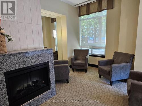 3505 - 3504 Hurontario Street, Mississauga, ON - Indoor Photo Showing Living Room With Fireplace