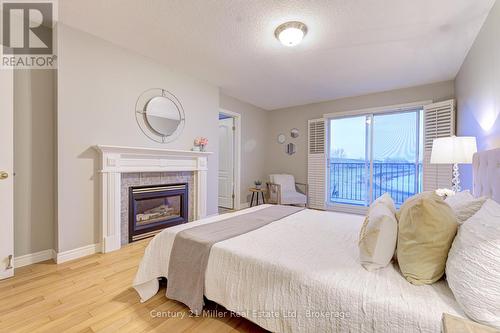 487 Dewitt Road, Hamilton (Lakeshore), ON - Indoor Photo Showing Bedroom With Fireplace