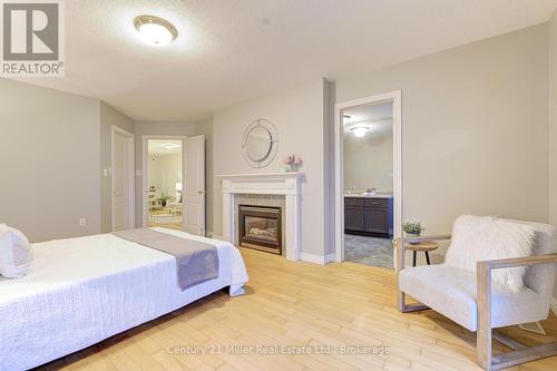 487 Dewitt Road, Hamilton (Lakeshore), ON - Indoor Photo Showing Bedroom With Fireplace