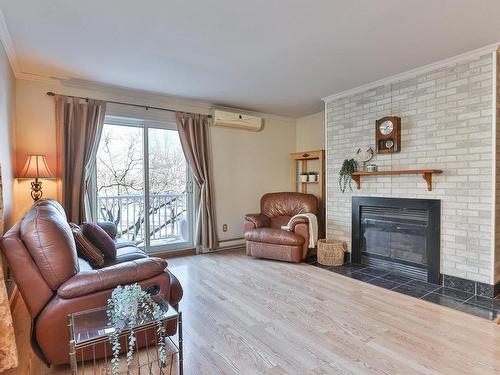 Living room - 1014 Rue De La Famille-Dubreuil, Montréal (Rivière-Des-Prairies/Pointe-Aux-Trembles), QC - Indoor Photo Showing Living Room With Fireplace