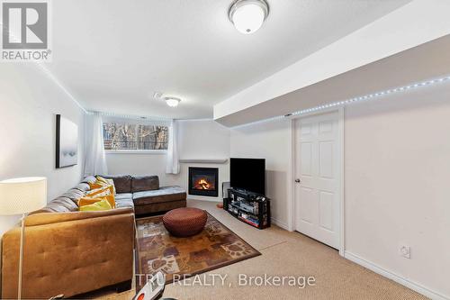 118 Tacom Circle, Ottawa, ON - Indoor Photo Showing Living Room With Fireplace