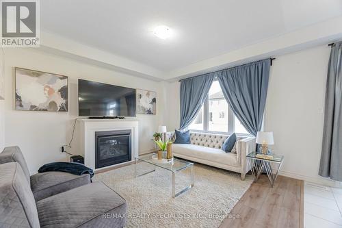 35 Spicer Street, Centre Wellington, ON - Indoor Photo Showing Living Room With Fireplace