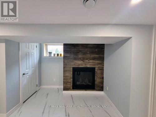 Lower - 6476 Maranda Street, Niagara Falls (216 - Dorchester), ON - Indoor Photo Showing Living Room With Fireplace