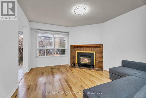 58 - 3600 Colonial Drive, Mississauga, ON - Indoor Photo Showing Living Room With Fireplace