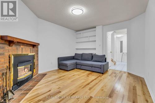 58 - 3600 Colonial Drive, Mississauga, ON - Indoor Photo Showing Living Room With Fireplace