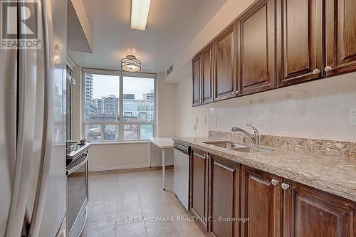 303 - 238 Doris Avenue, Toronto, ON - Indoor Photo Showing Kitchen With Double Sink