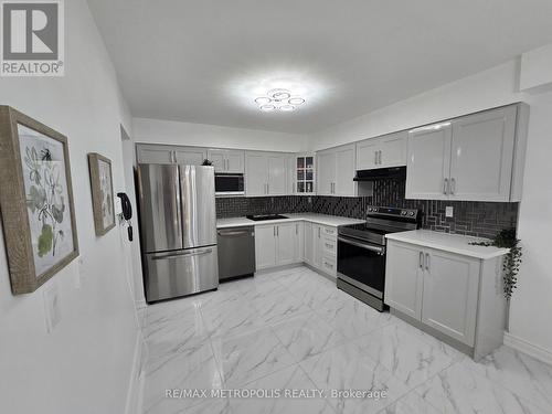 107 - 1701 Mccowan Road, Toronto, ON - Indoor Photo Showing Kitchen With Stainless Steel Kitchen