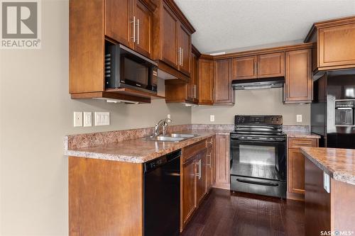 156 4100 Sandhill Crescent, Regina, SK - Indoor Photo Showing Kitchen With Double Sink