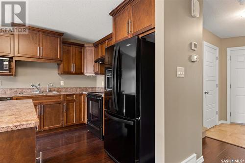 156 4100 Sandhill Crescent, Regina, SK - Indoor Photo Showing Kitchen With Double Sink