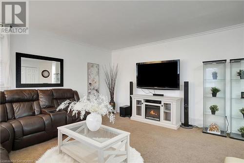 Carpeted living room featuring ornamental molding - 362 Blair Road, Cambridge, ON - Indoor Photo Showing Living Room