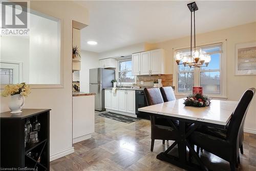 Dining room featuring a chandelier, plenty of natural light, and sink - 362 Blair Road, Cambridge, ON - Indoor Photo Showing Dining Room