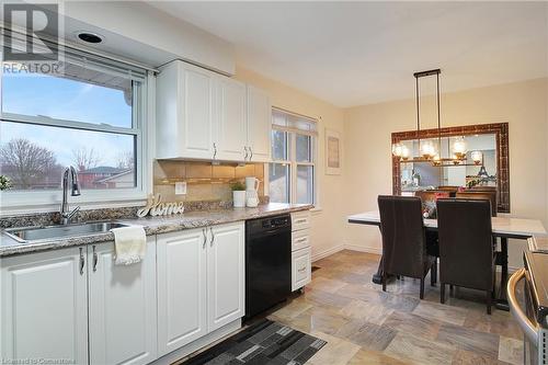 Kitchen with white cabinetry, sink, dishwasher, and a healthy amount of sunlight - 362 Blair Road, Cambridge, ON - Indoor Photo Showing Kitchen