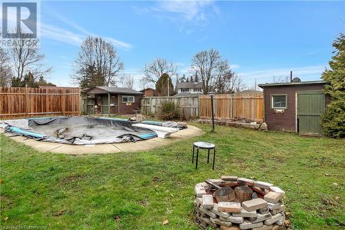 View of yard with a shed and an outdoor fire pit - 362 Blair Road, Cambridge, ON - Outdoor With Backyard