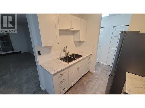 2316 2607 Pear Street, Terrace, BC - Indoor Photo Showing Kitchen With Double Sink