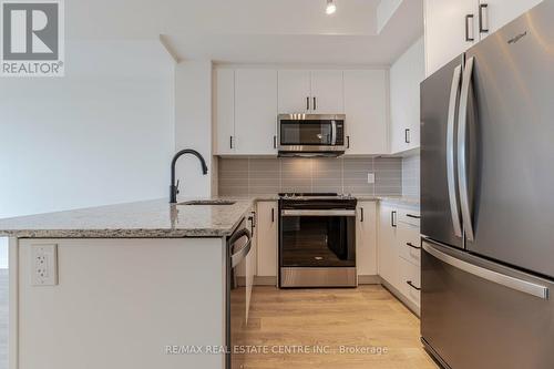 608 - 345 Wheat Boom Drive, Oakville, ON - Indoor Photo Showing Kitchen With Upgraded Kitchen