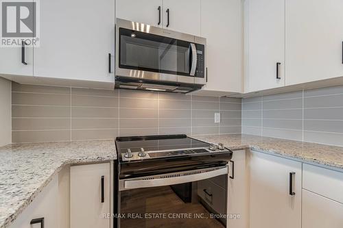 608 - 345 Wheat Boom Drive, Oakville, ON - Indoor Photo Showing Kitchen With Upgraded Kitchen